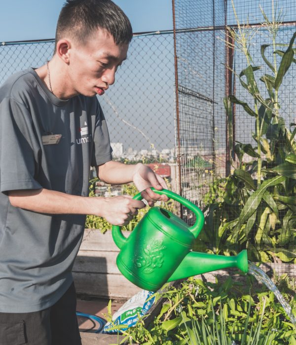 Blue Dragon-Child with disabilities takes care of the garden