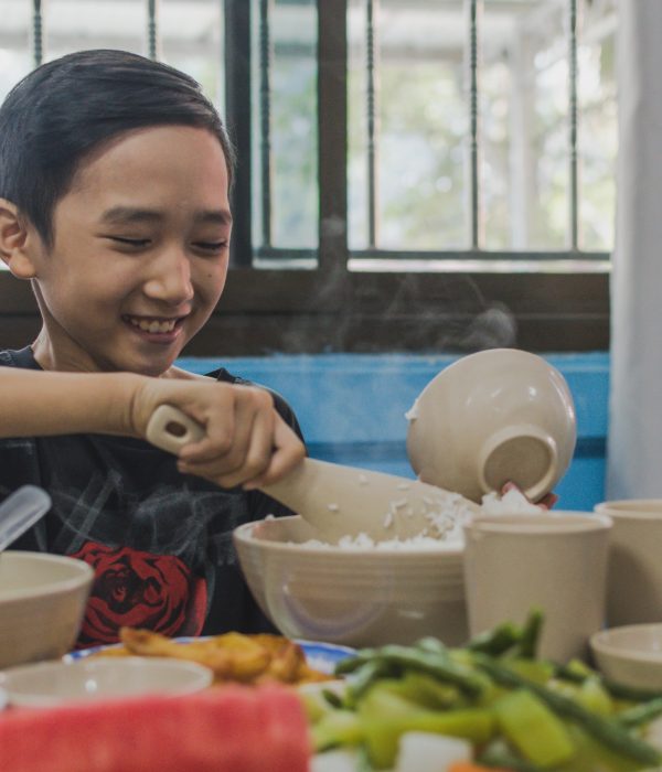 Blue Dragon-Kids having lunch at the center